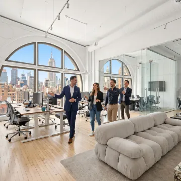Startup team touring a modern office space
