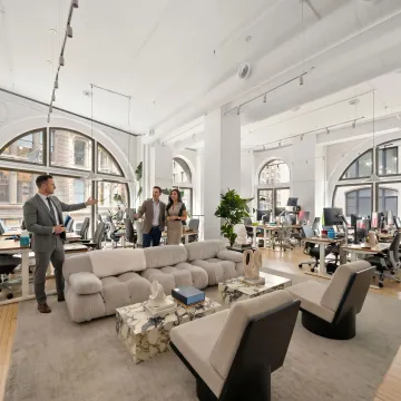 Startup team touring modern office space