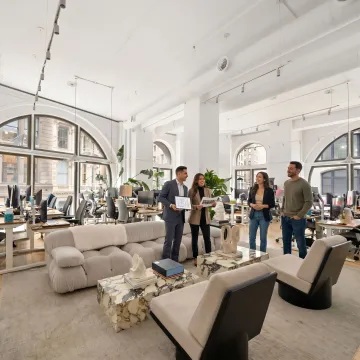 Commercial real estate advisors touring office space with clients