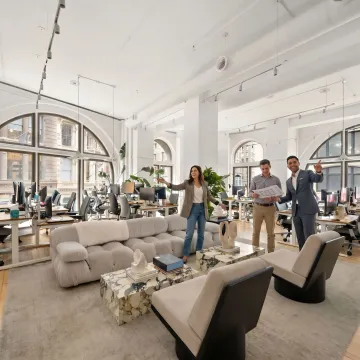 Startup team touring a modern office space