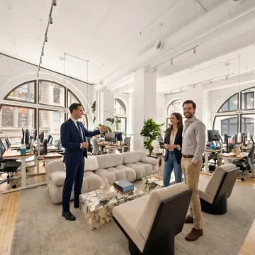 Startup team touring a modern office space