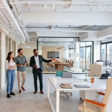 Startup team touring a flexible office suite