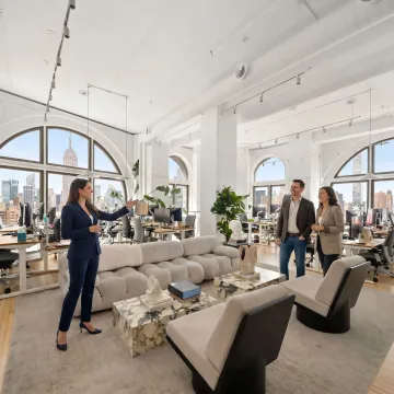 Commercial real estate broker touring office space with clients
