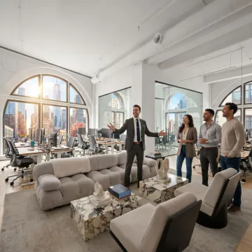 Commercial real estate broker touring startup office space