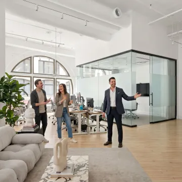 Startup team touring a flexible office space