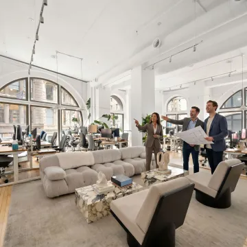 Startup team touring a modern office space