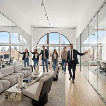 Startup team touring modern office space