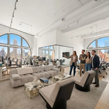 Startup team touring a modern office space