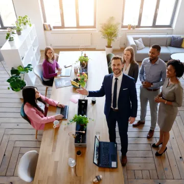 Team touring flexible office space with broker