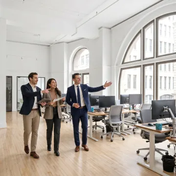 Startup team touring a modern NYC office space