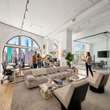 Startup team touring a modern office space
