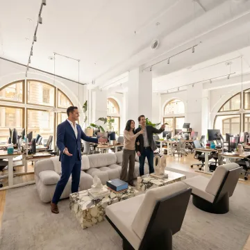 Commercial real estate team touring startup office space