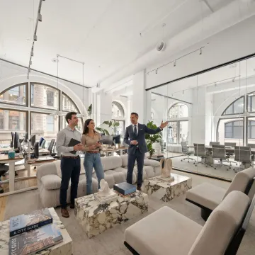 Startup team touring a commercial office space