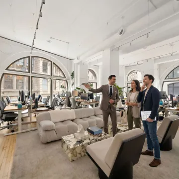 Startup team touring a modern office space