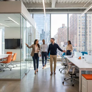 Startup team touring a flexible office space