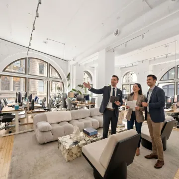 Startup team touring a modern office space