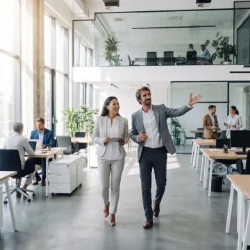Startup team touring a modern office space