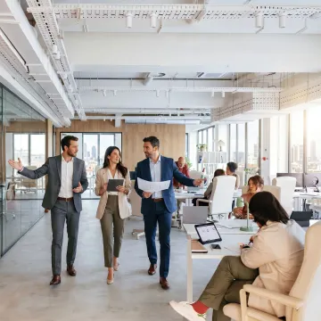 Startup team touring a modern office space
