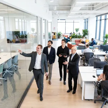 Startup team touring a shared office space