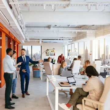 Broker touring flexible office space with client
