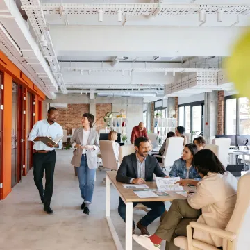 Team reviewing coworking office options