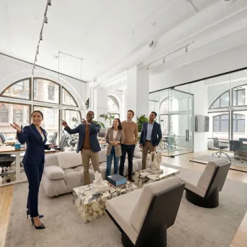 Startup team touring a modern NYC office space