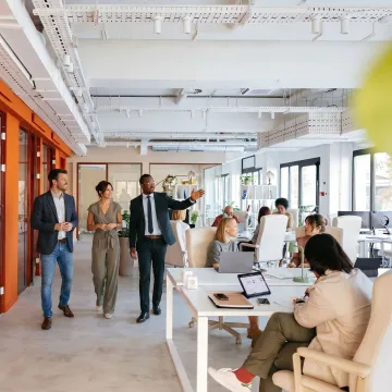 Commercial real estate team touring startup office space