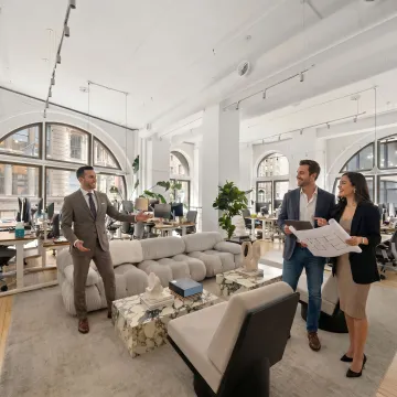 Startup team touring a modern office space