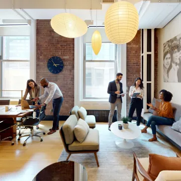 Team working inside a furnished private office suite