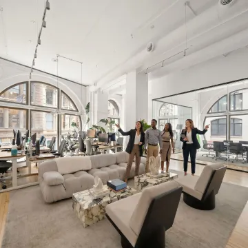 Startup team touring modern office space