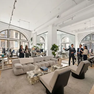 Startup team touring a modern office space