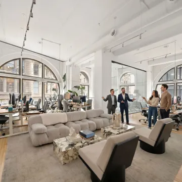 Commercial real estate team touring a modern office space
