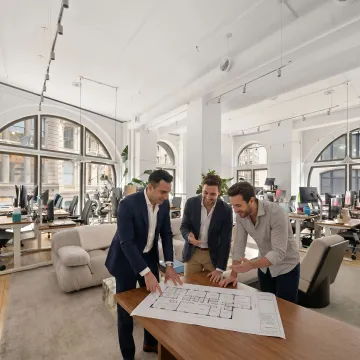 Broker guiding clients through office leasing process