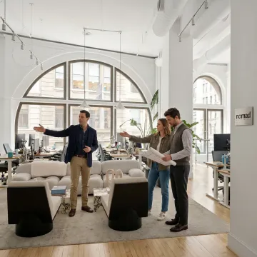 Startup team touring a modern office space