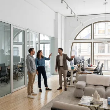 Startup team touring modern office space