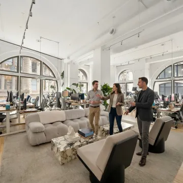 Startup team touring a modern NYC office space