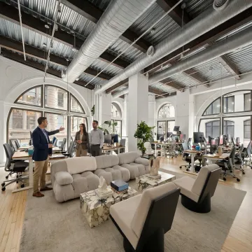 Commercial agent leading an office tour in NYC
