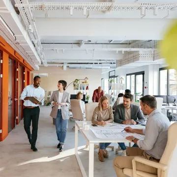 Advisor reviewing NYC office plans with founders