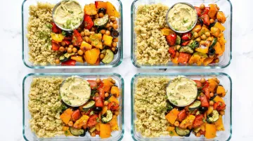 Vegan meal prep lunch containers with seitan stir-fry brown rice and vegetables
