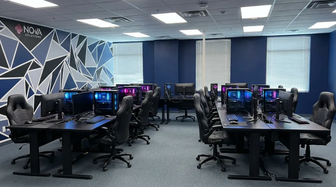 Esports training station multi-desk U-configuration with matching chairs and monitors