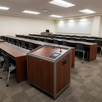 Modern modular classroom furniture setup with computer training desks and AV lectern in a California school