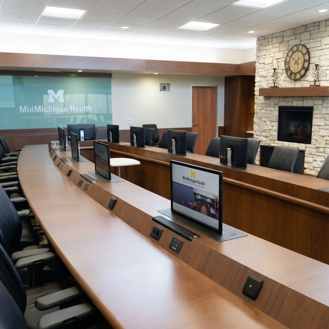Technology-integrated furniture in a conference room