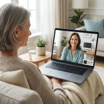A compassionate nutritional counselor conducting a one-on-one Zoom consultation with a blood cancer patient at home.