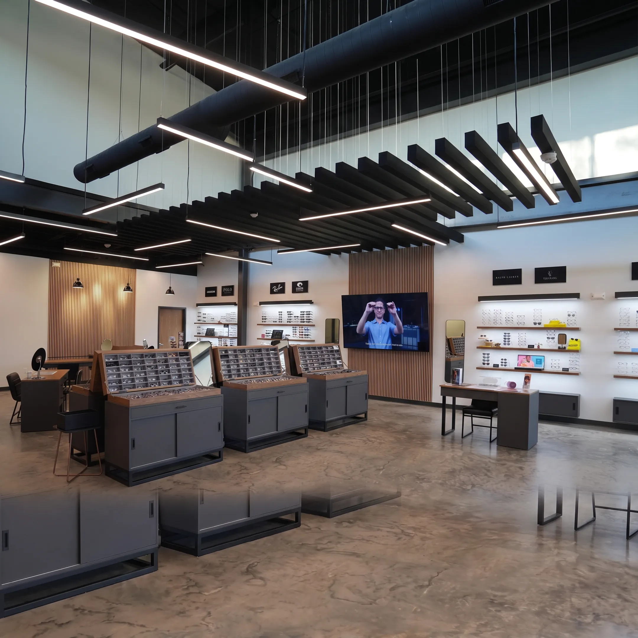 Optical design team planning eyewear displays, branded graphics, lighting, and patient flow for a dispensary