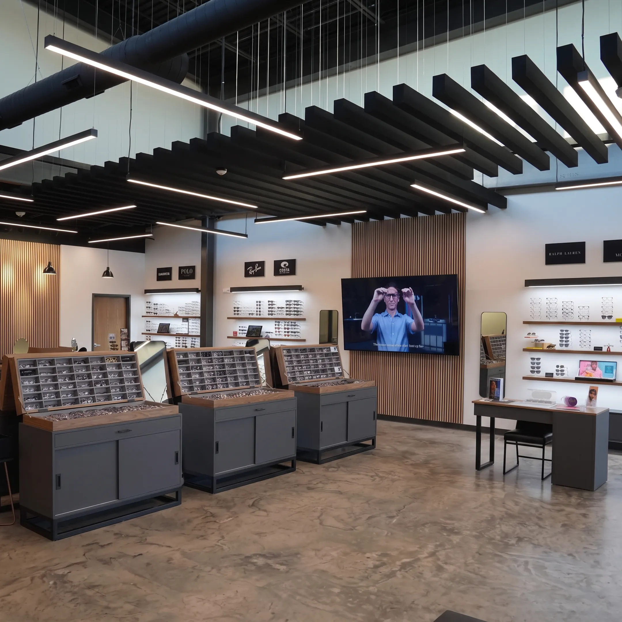 Designer planning an optical retail interior with eyewear fixtures and branded signage