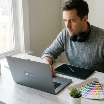 Designer creating branded social media graphics
