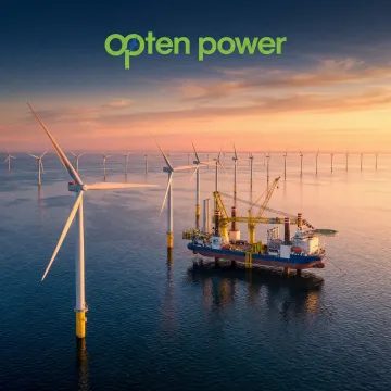 Offshore wind turbines under development in open ocean waters at sunrise