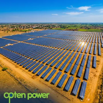 Utility scale solar farm with rows of panels under a bright sky, representing large-scale renewable energy projects in India