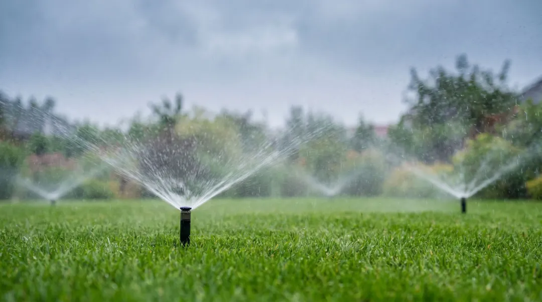 Automated irrigation system shutting off during rainfall in residential landscape