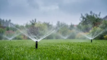 Automated irrigation system shutting off during rainfall in residential landscape